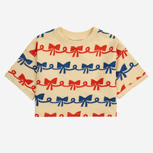 Load image into Gallery viewer, Bobo Choses - pale yellow cropped sweatshirt with all over ribbon bow print in red and blue