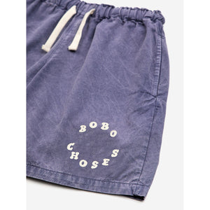 Bobo Choses - dark washed blue woven shorts with circle logo on leg