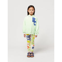 Load image into Gallery viewer, Bobo Choses - off white leggings with all over abstract carnival print in red, green, yellow and blue
