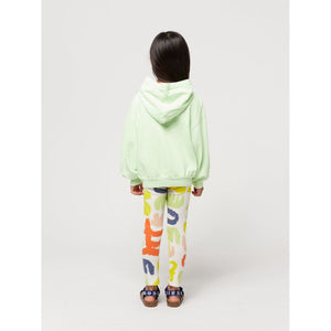 Bobo Choses - off white leggings with all over abstract carnival print in red, green, yellow and blue