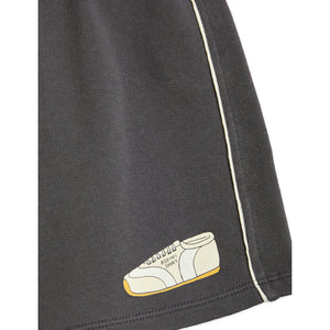Mini Rodini - black shorts with white piped trim and trainer print