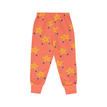 Load image into Gallery viewer, Tinycottons - papaya/ pale orange sweatpants with all over dancing stars print in yellow
