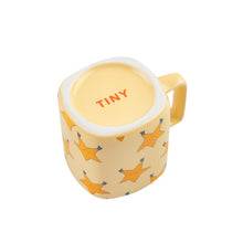 Load image into Gallery viewer, Tinycottons - pale yellow ceramic mug with all over dancing stars design in darker yellow
