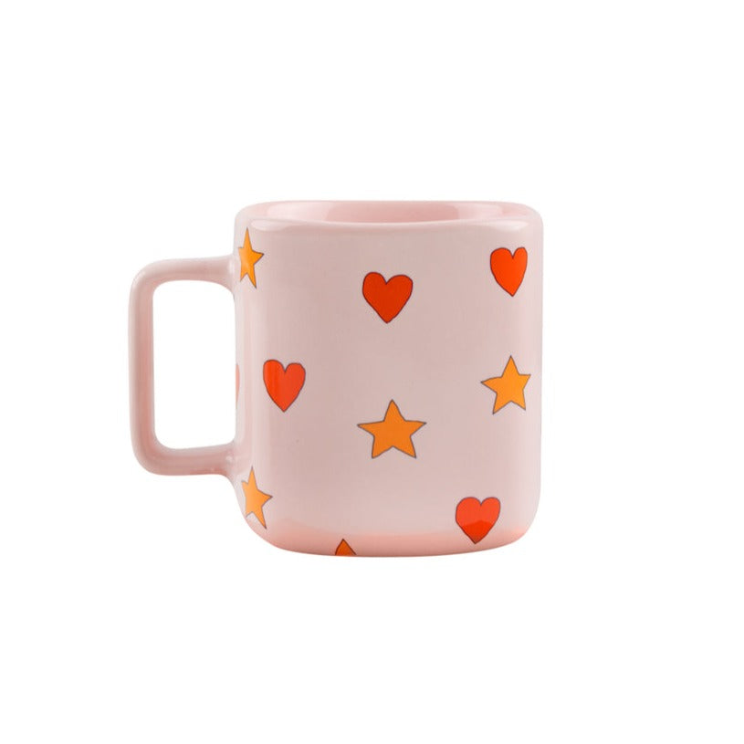 Tinycottons - pale pink ceramic mug with all over red heart and yellow star design