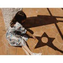 Load image into Gallery viewer, Tinycottons - jade green shiny skirt with 'Tiny' print in red, blue and green