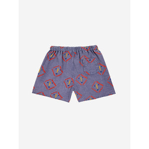 Bobo Choses - dark washed blue woven shorts with all over mask print