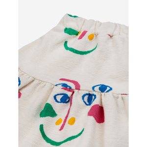 Bobo Choses - white skirt with all over smiley face print in pink and green
