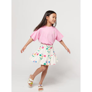 Bobo Choses - white skirt with all over smiley face print in pink and green