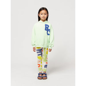 Bobo Choses - off white leggings with all over abstract carnival print in red, green, yellow and blue