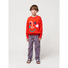 Load image into Gallery viewer, Bobo Choses - dark blue chino trousers with all over mask face print
