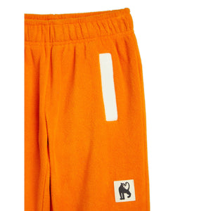 Mini Rodini - Orange fleece trousers with white panel