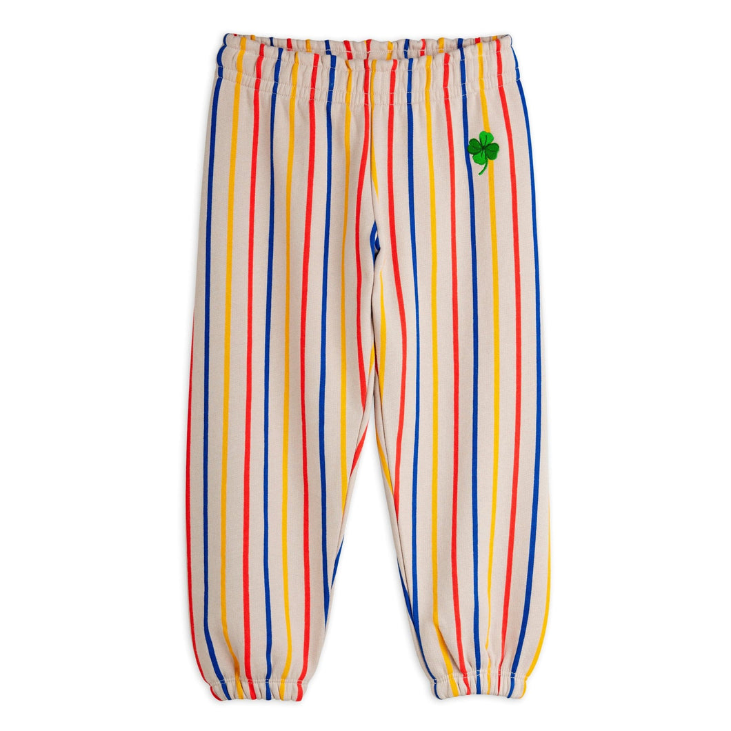 Mini Rodini striped pants with a green clover patch 