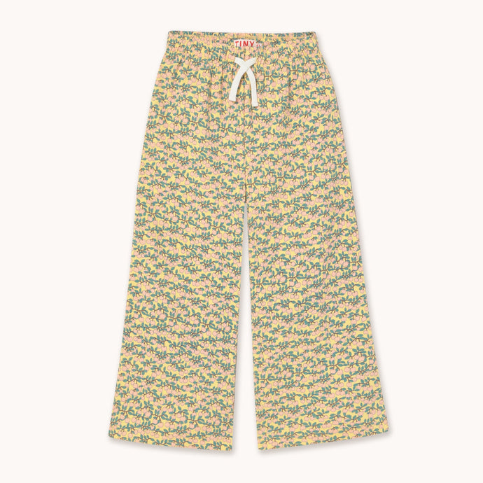 Tinycottons soft yellow trousers with all over mini apple branch print in pink and green