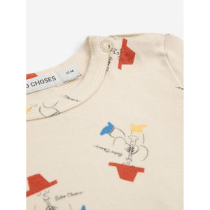 Bobo Choses baby bodysuit in cream with all over magic flute print from the new AW24 collection 'Once Upon A Time'