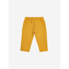 Load image into Gallery viewer, Bobo Choses quilted baby trousers in mustard yellow with blue patched knees from the new AW24 collection &#39;Once Upon A Time&#39;
