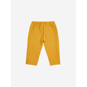 Bobo Choses quilted baby trousers in mustard yellow with blue patched knees from the new AW24 collection 'Once Upon A Time'