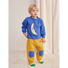 Load image into Gallery viewer, Bobo Choses quilted baby trousers in mustard yellow with blue patched knees from the new AW24 collection &#39;Once Upon A Time&#39;
