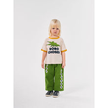 Load image into Gallery viewer, Bobo Choses off white t-shirt with yellow trim and green crocodile print from the new AW24 collection &#39;Once Upon A Time&#39;
