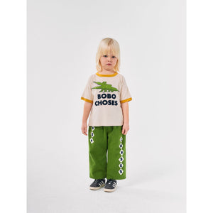 Bobo Choses off white t-shirt with yellow trim and green crocodile print from the new AW24 collection 'Once Upon A Time'