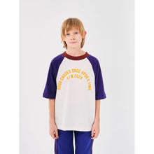 Load image into Gallery viewer, Bobo Choses off white t-shirt with yellow &#39;Once Upon a Time&#39; logo, indigo raglan sleeves and burgundy neck from the new AW24 collection &#39;Once Upon A Time&#39;
