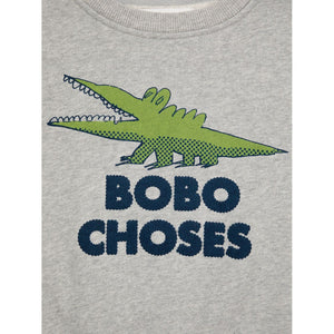 Bobo Choses grey sweatshirt with green crocodile print from the new AW24 collection 'Once Upon A Time'