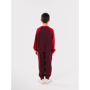 Bobo Choses burgundy and red vintage style sweatpants from the new AW24 collection 'Once Upon A Time'