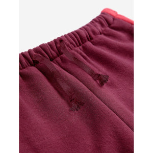 Bobo Choses burgundy and red vintage style sweatpants from the new AW24 collection 'Once Upon A Time'