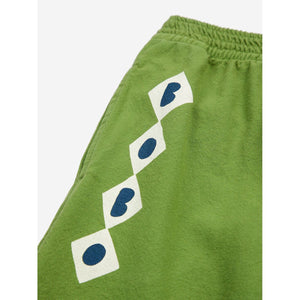 Bobo Choses green trousers with diamond pattern in white from the new AW24 collection 'Once Upon A Time'