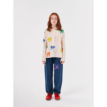 Load image into Gallery viewer, Bobo Choses blue denim trousers with funny face patch&nbsp;from the new AW24 collection &#39;Once Upon A Time&#39;
