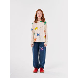 Bobo Choses blue denim trousers with funny face patch&nbsp;from the new AW24 collection 'Once Upon A Time'