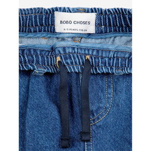 Bobo Choses blue denim trousers with funny face patch&nbsp;from the new AW24 collection 'Once Upon A Time'