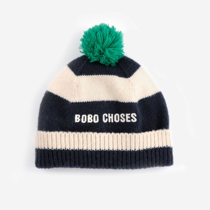 Navy and cream striped beanie with green pom-pom and 'BOBO CHOSES' branding 