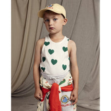 Load image into Gallery viewer, Mini rodini - white vest with all over green heart print

