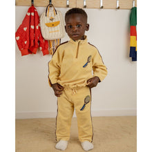 Load image into Gallery viewer, Mini Rodini light yellow cotton terry trousers with stripe detail 
