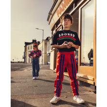 Load image into Gallery viewer, Mini Rodini - Black t-shirt with Adored print and red and green stripe
