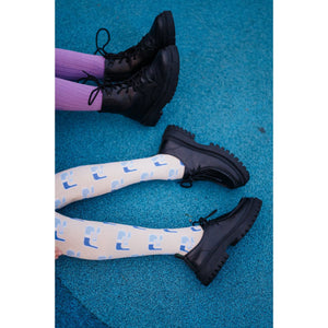 Repose AMS - cream ribbed tights with all over blue logo design