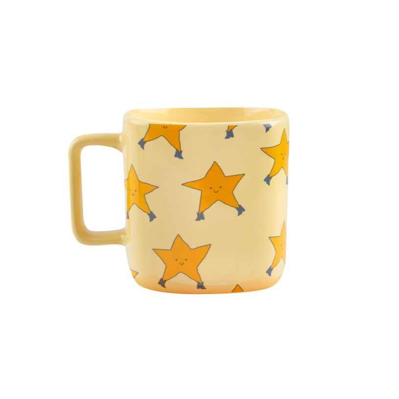 Tinycottons - pale yellow ceramic mug with all over dancing stars design in darker yellow